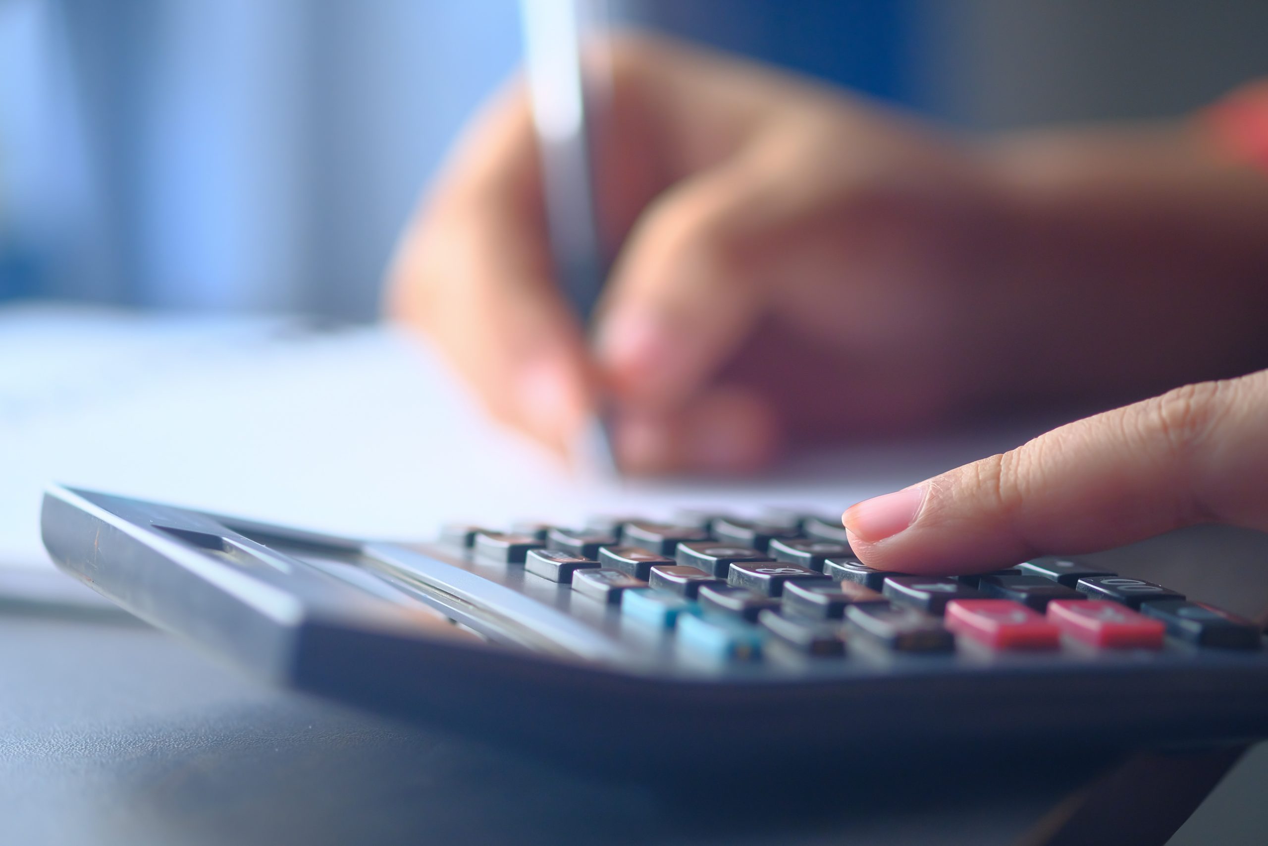hand by a calculator